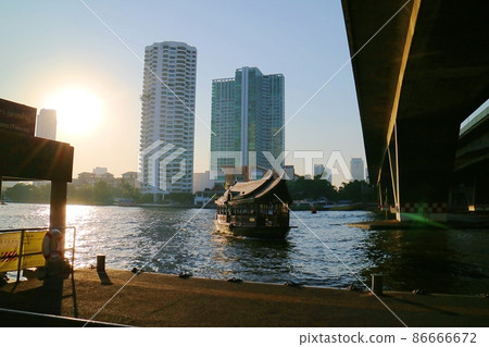 A view of the Chao Phraya River in Bangkok, Thailand. Ships are preparing to enter the port A view of the Chao Phraya River in Bangkok, Thailand. Ships are preparing to enter the port 86666672