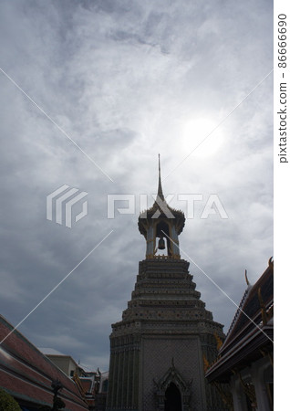 The Grand Palace in Bangkok, Thailand under the blue sky and white clouds. Sharp pagoda architecture The Grand Palace in Bangkok, Thailand under the blue sky and white clouds. Sharp pagoda architecture 86666690
