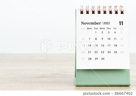 November 2022 desk calendar on wooden background. November 2022 desk calendar on wooden background. 86667402