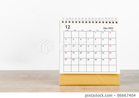 December 2022 desk calendar on wooden background. December 2022 desk calendar on wooden background. 86667404