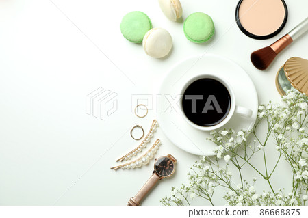 Female accessories and macaroons on white background 86668875
