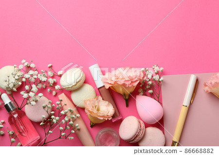 Female accessories and macaroons on pink background 86668882