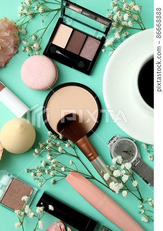 Female accessories and macaroons on mint background Female accessories and macaroons on mint background 86668888
