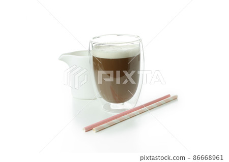 Glass of irish coffee, straws and milk isolated on white background 86668961