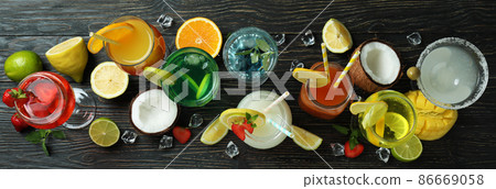 Fresh summer cocktails on rustic wooden table Fresh summer cocktails on rustic wooden table 86669058
