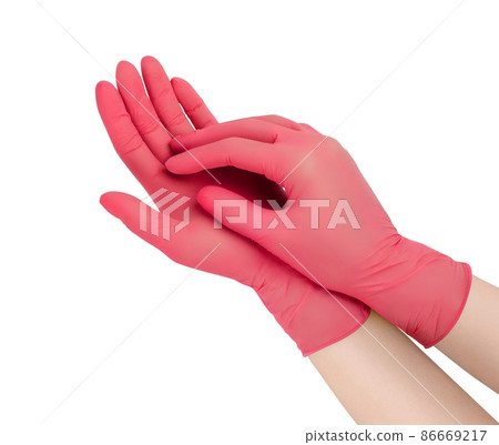 Medical gloves. Two red surgical gloves isolated on white background with hands. Rubber glove manufacturing, human hand is wearing a latex glove. Doctor or nurse putting on protective gloves. 86669217