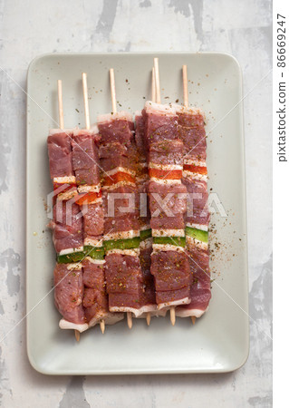 meat with pepper for barbecue on the dish meat with pepper for barbecue on the dish 86669247
