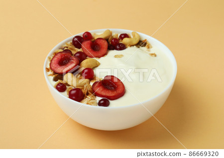 Concept of tasty breakfast with yogurt on beige background 86669320