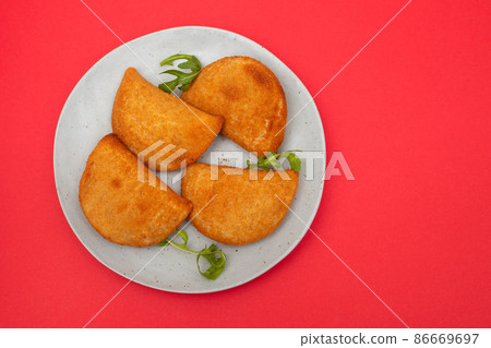 typical portuguese appetizer rissois de carne on plate 86669697