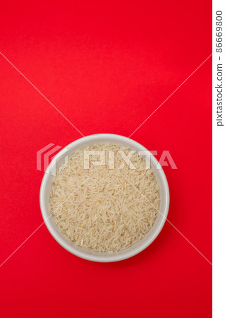 raw rice on white bowl on gray ceramic raw rice on white bowl on gray ceramic 86669800