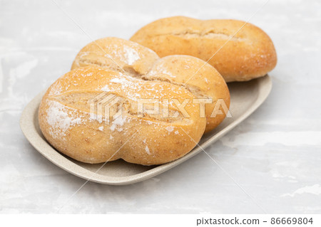 fresh bread in small dish on gray ceramic fresh bread in small dish on gray ceramic 86669804