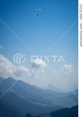 paragliding flight in the mountains. Le Grand-Bornand, France 86670187