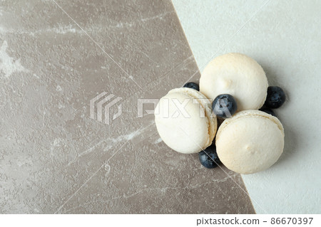 Concept of tasty dessert with delicious macaroons Concept of tasty dessert with delicious macaroons 86670397
