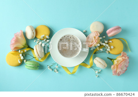 Concept of tasty dessert with macaroons on blue background 86670424