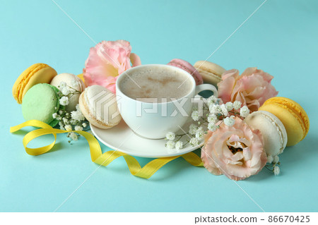 Concept of tasty dessert with macaroons on blue background 86670425