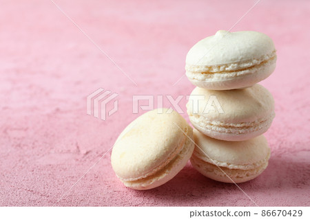 Concept of tasty dessert with macaroons on pink background 86670429