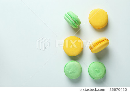 Concept of tasty dessert with macaroons on white background Concept of tasty dessert with macaroons on white background 86670430