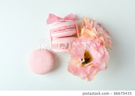 Concept of tasty dessert with macaroons on white background Concept of tasty dessert with macaroons on white background 86670435