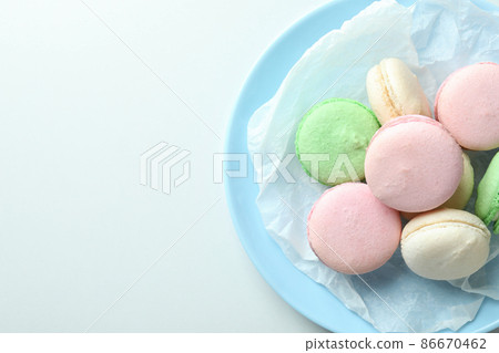 Concept of tasty dessert with macaroons on white background 86670462