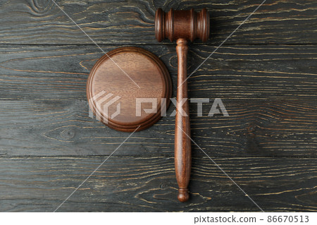 Judge gavel on rustic wooden background, top view Judge gavel on rustic wooden background, top view 86670513