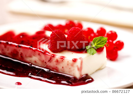 Panna Cotta with Fresh Red Berries on a Plate. Panna Cotta with Fresh Red Berries on a Plate. 86672127