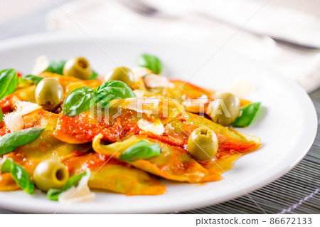 Ravioli Pasta with Tomato Sauce, Olives and Basil Ravioli Pasta with Tomato Sauce, Olives and Basil 86672133