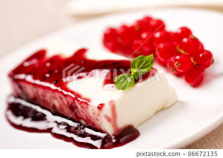 Panna Cotta with Fresh Red Berries on a Plate. Panna Cotta with Fresh Red Berries on a Plate. 86672135