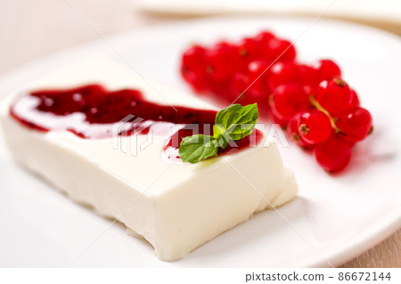 Panna Cotta with Fresh Red Berries on a Plate. 86672144