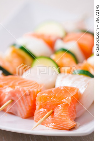 Raw Fish skewers on a Plate. High quality photo 86672145