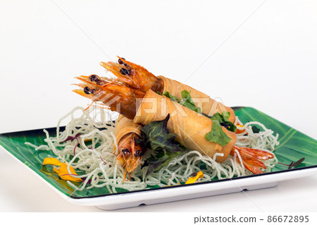Fried Shrimps wrapped and crispy fried noodles on white background Fried Shrimps wrapped and crispy fried noodles on white background 86672895