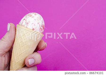 Vanilla ice cream waffle horns with decoration eggs on pink background. Minimalism. Creative Easter concept. Studio Photo Vanilla ice cream waffle horns with decoration eggs on pink background. Minimalism. Creative Easter concept. Studio Photo 86674101