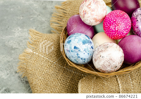 Bright colored Easter eggs on platter, holiday background. Studio Photo 86674221
