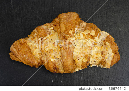 Fresh sweet croissants for breakfast on white. Studio Photo 86674342