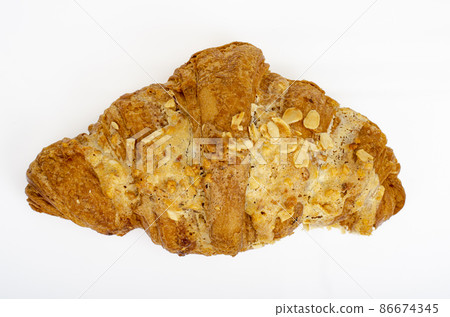 Fresh sweet croissants for breakfast on white. Studio Photo 86674345