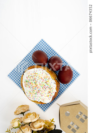 Preparation for celebration of Easter. Homemade cake and red colored eggs. Studio Photo 86674352