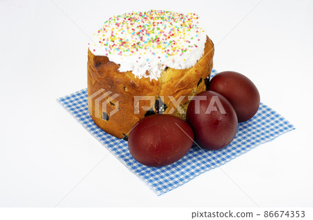 Preparation for celebration of Easter. Homemade cake and red colored eggs. Studio Photo 86674353