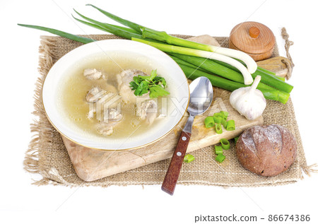 Broth with chicken meat Isolated on White background Broth with chicken meat Isolated on White background 86674386