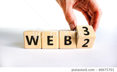 WEB 2 or 3 symbol. Businessman turns a wooden cube and changes words WEB 2 to WEB 3. Beautiful white table, white background, copy space. Business, technology and WEB 2 or 3 concept. WEB 2 or 3 symbol. Businessman turns a wooden cube and changes words WEB 2 to WEB 3. Beautiful white table, white background, copy space. Business, technology and WEB 2 or 3 concept. 86675701