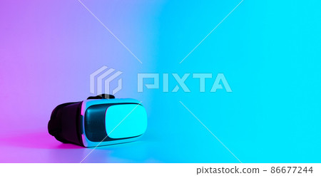 VR headset virtual reality. 3d digital glasses on futuristic neon tech background. Innovation device, cyberspace technology. VR headset virtual reality. 3d digital glasses on futuristic neon tech background. Innovation device, cyberspace technology. 86677244