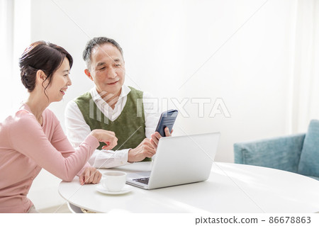 Senior couple thinking about family trip Senior couple thinking about family trip 86678863
