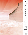 A wonderful view from the window of an airplane: red-orange and light like the setting sun 86680628
