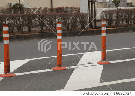 Lane separation mark constructed on the road (cloudy weather) 86681724