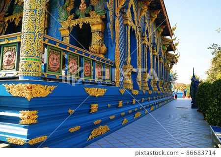 Blue building decorated with gilded gold at Rong Suea Ten Temple, a famous attraction in Chiang Rai, Thailand 86683714