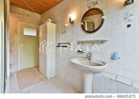 Luxury interior design of a bathroom with marble walls 86685875