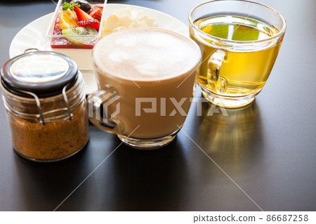 strawberry cream and a cup of tea and coffee  86687258