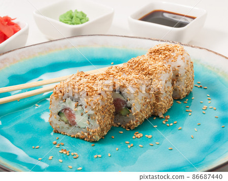 sushi roll with salmon, cucumber, sesame cheese 86687440