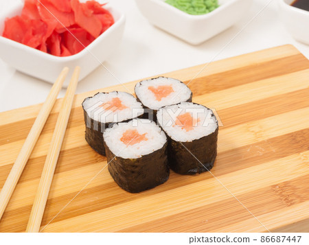 sushi roll with salmon in nori seaweed on a wooden Board 86687447