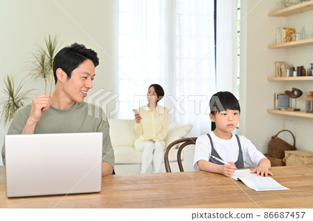 Girl studying next to her father during telework Girl studying next to her father during telework 86687457