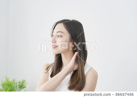 Female living room that touches hair Female living room that touches hair 86687486