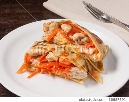 hot spicy pancake with chicken carrots tomatoes hot spicy pancake with chicken carrots tomatoes 86687591
